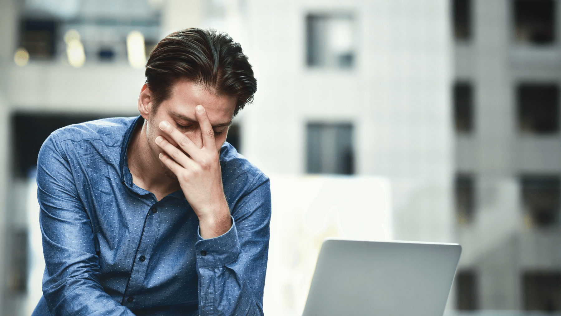 man sad at laptop
